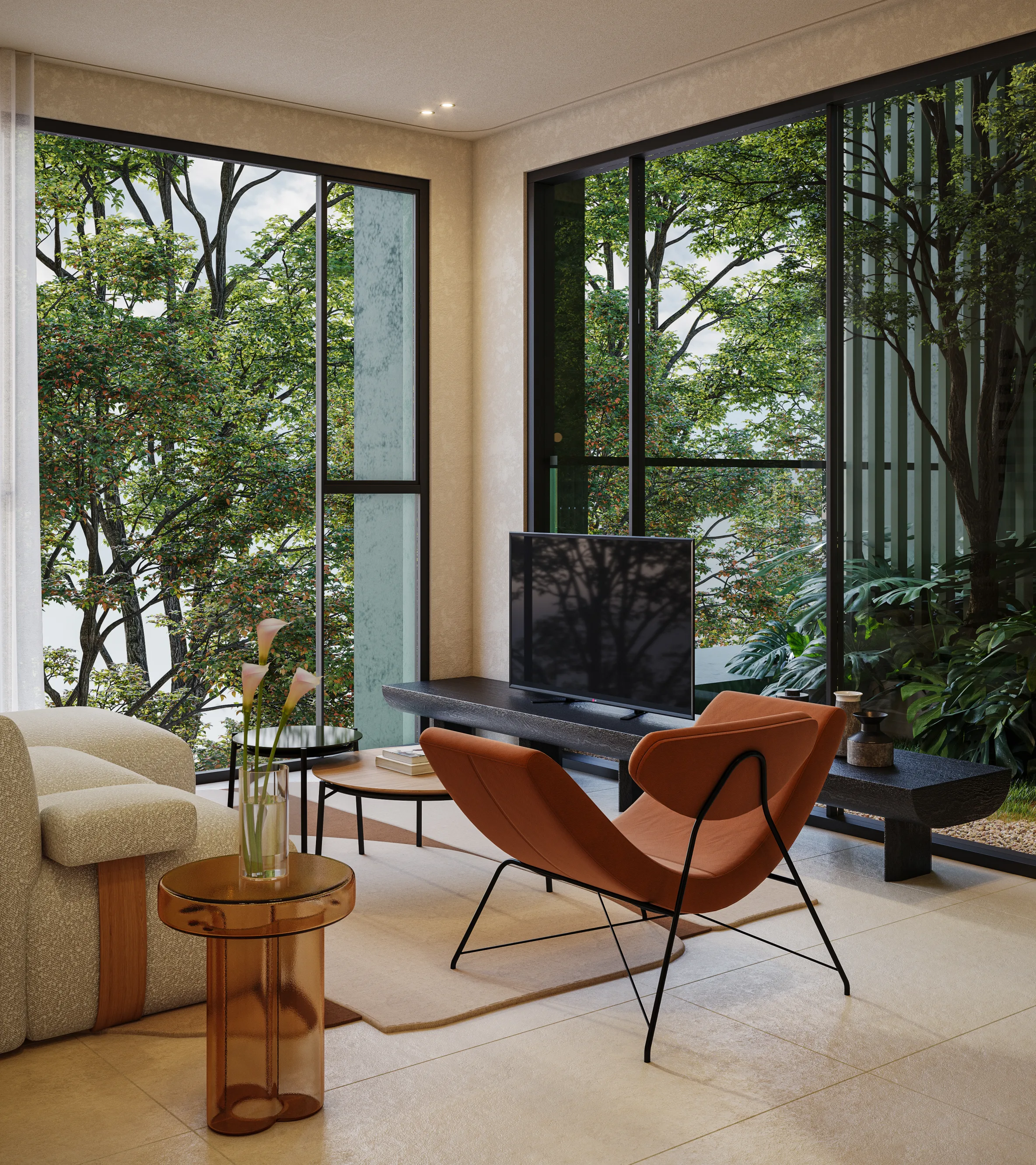 Living room with armchairs and a large window onto the greenery